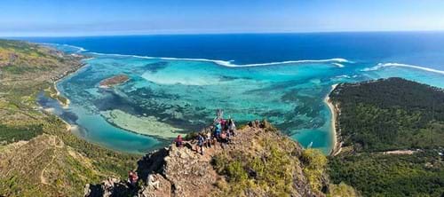 People on the top of Le Morne Mountain